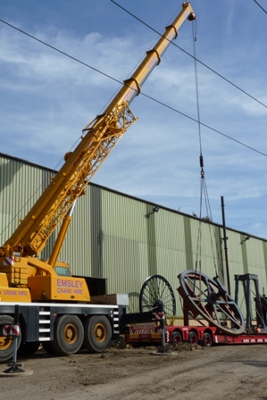 Lifting the flywheel. The crane driver was a bit concerned with proximity of the overhead cables.