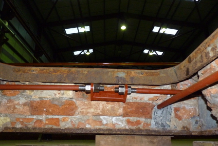 A view under the bedplate showing the two tie bars in place. The brickwork, underneath, was very hard and difficult to remove, and probably 