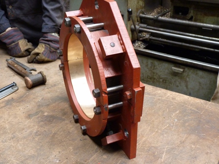 This shows the assembled bottom brass bearing, made to split into two halves to fit over the crankshaft.  The half brasses have been subdivi
